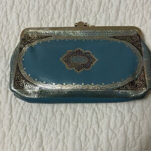 Vintage wallet/clutch. Still original tissue paper on the inside. Never used.